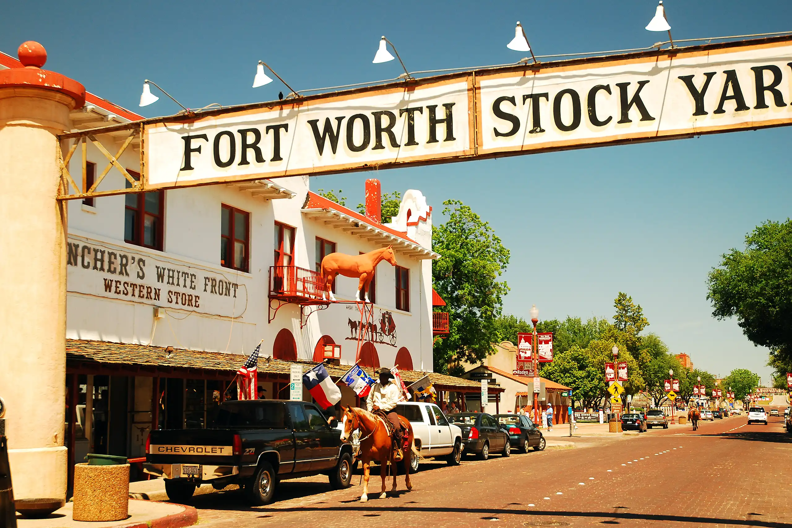 A sheriff patrols the streets of the Fort Worth Stockyards while riding on a horse